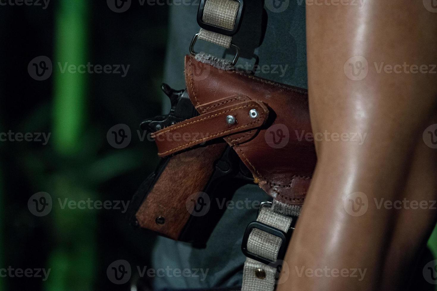 gun in shoulder holster detail photo