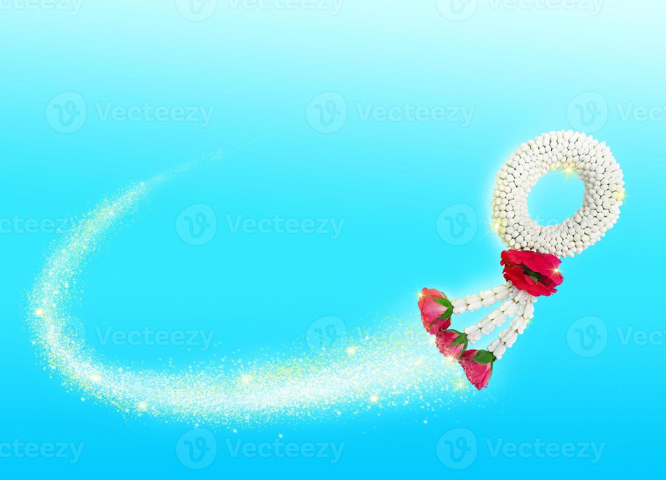 Thai jasmine garland has a magical floating effect. Mother's Day Symbol in Thailand to offer to a monk or Buddha on a blue background photo
