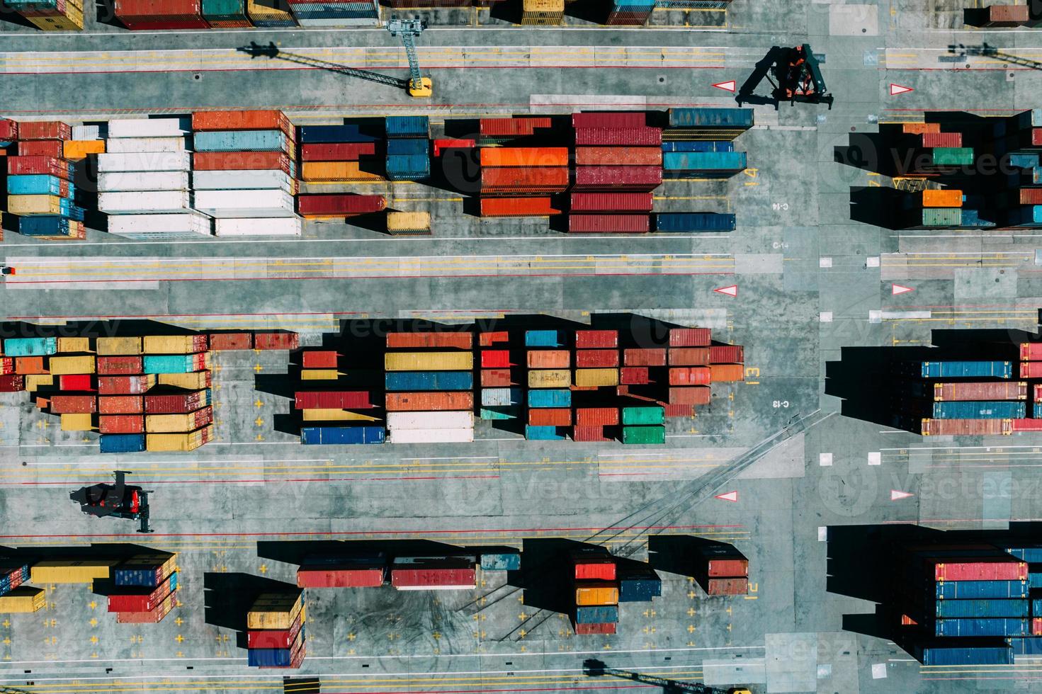 Aerial drone top down view of containers spread across a busy port, logistic and international trade concept photo