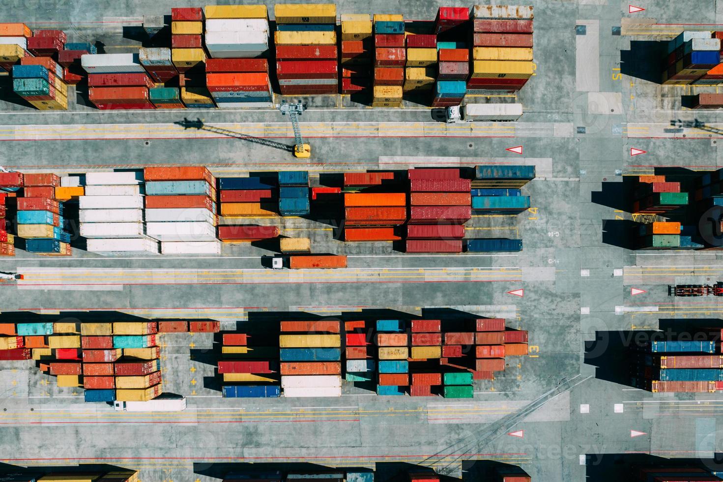 Aerial drone top down view of containers spread across a busy port, logistic and international trade concept photo