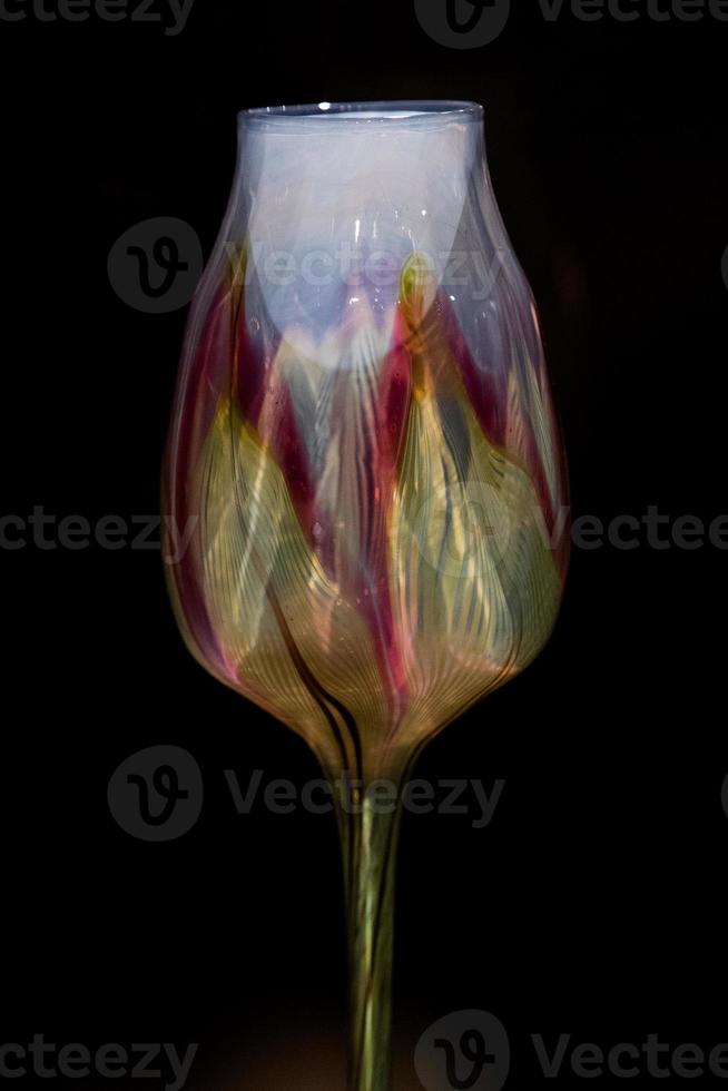 american liberty style old drinking glass isolated on black photo