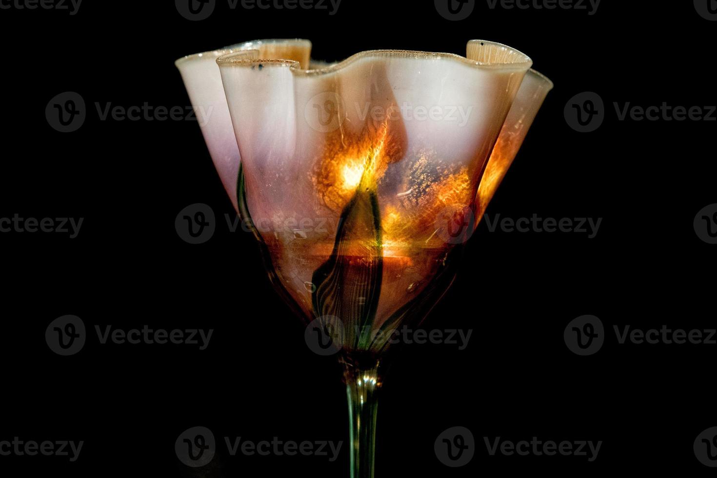 american liberty style old drinking glass isolated on black photo