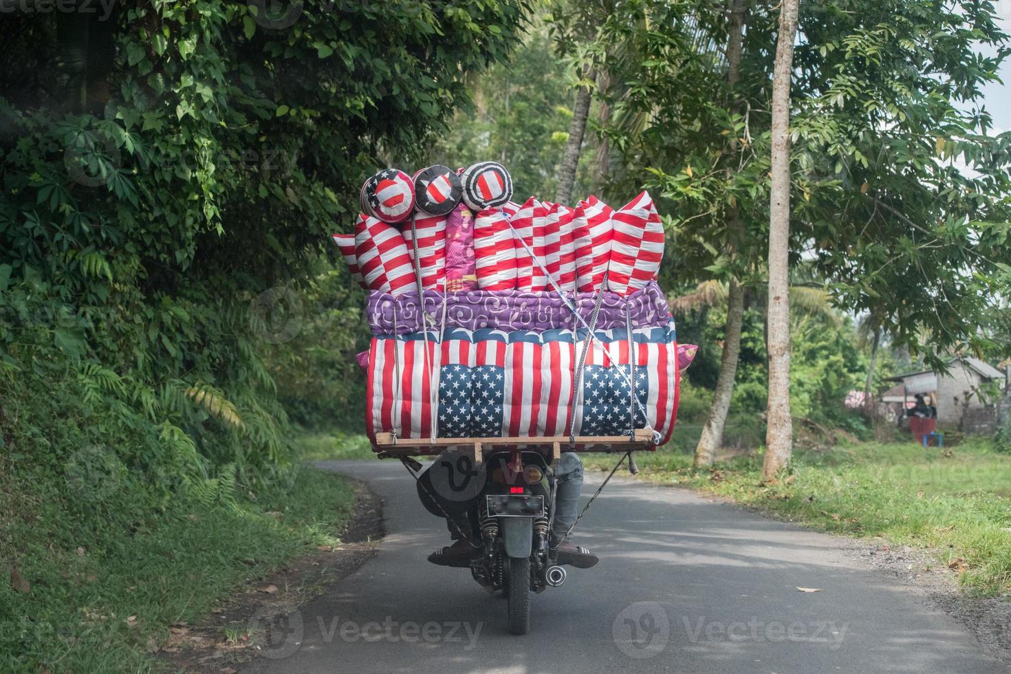 motorbike usa flag matrass seller in bali indonesia photo