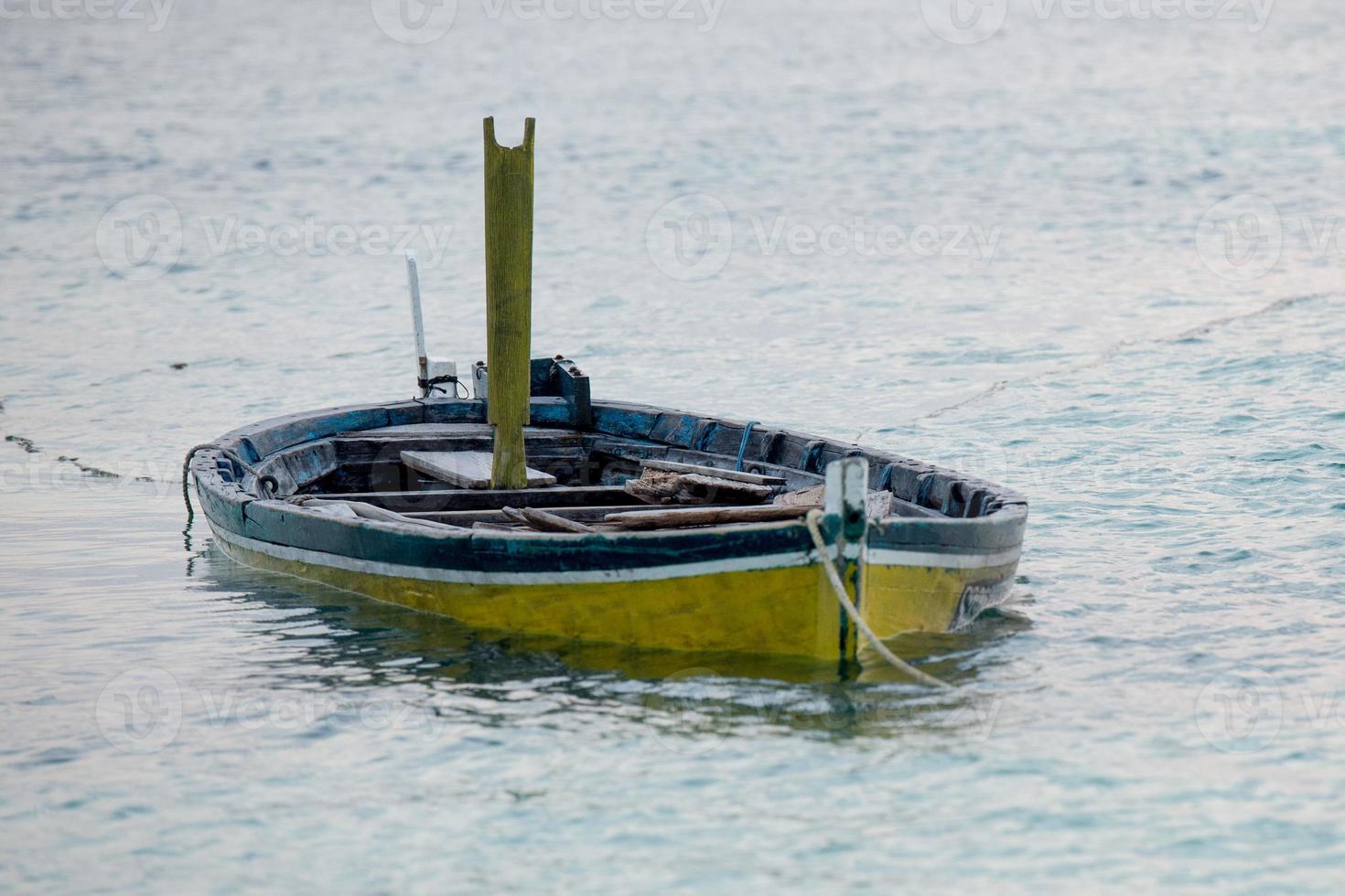 abandoned submerged woooden boat photo