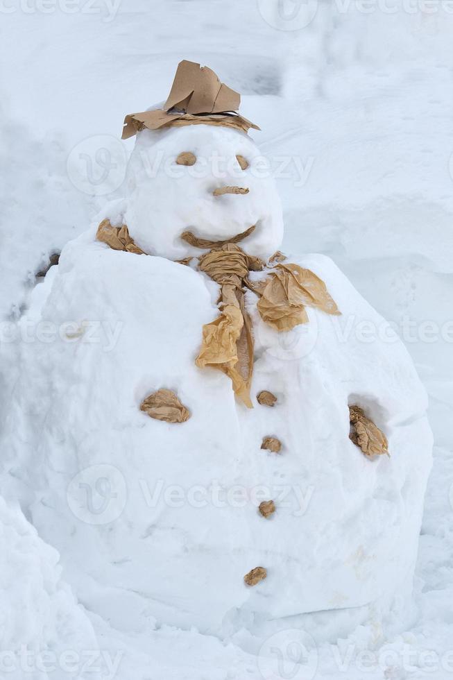 Real snowman on snow white background photo