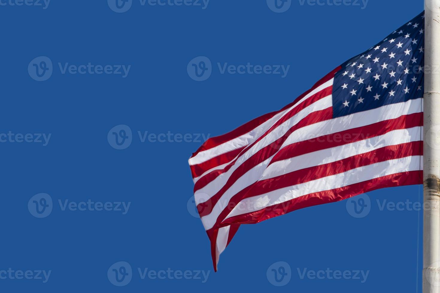 Usa American flag stars and stripes on the blue sky background photo