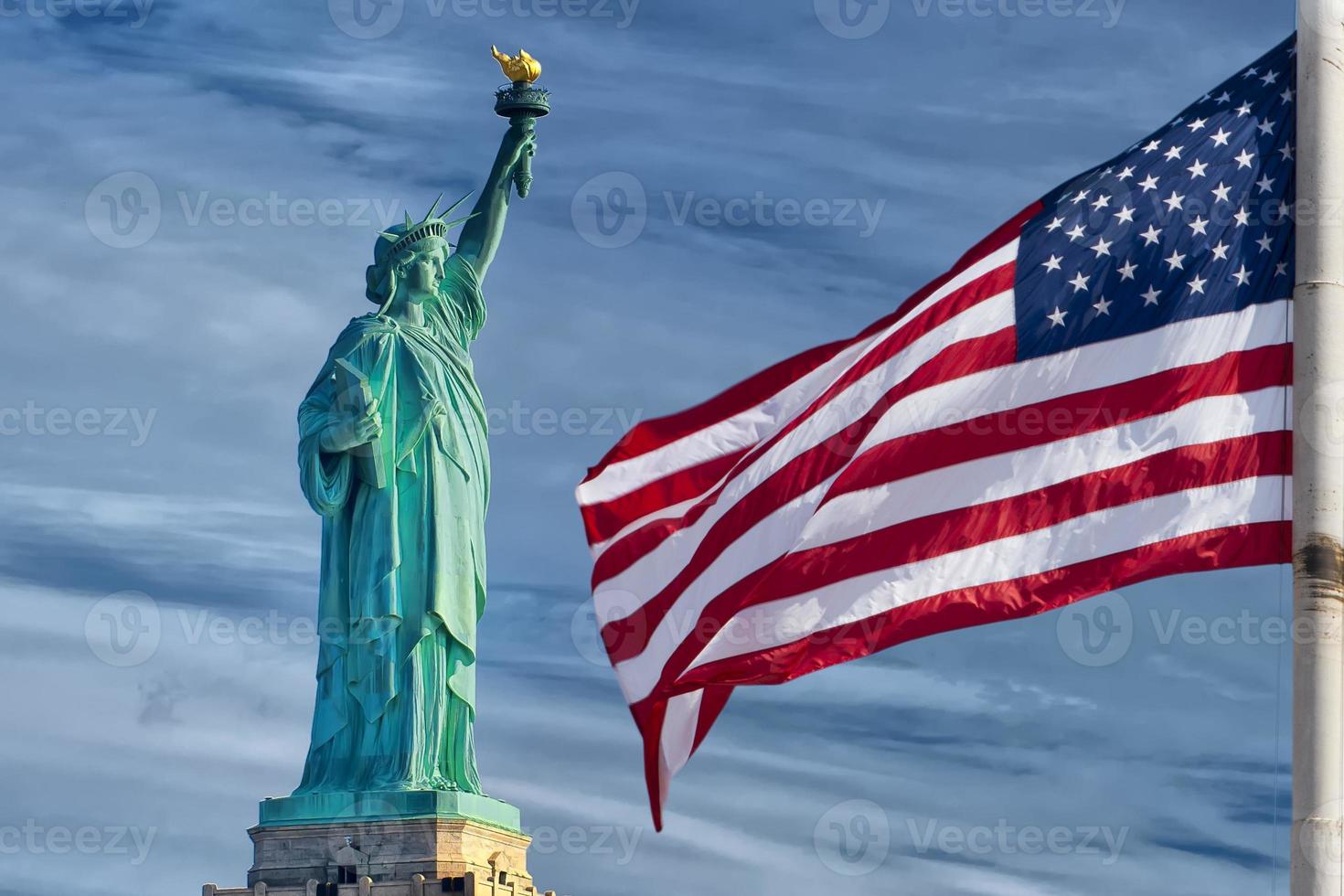 Usa American flag stars and stripes on statue of liberty blue sky background photo