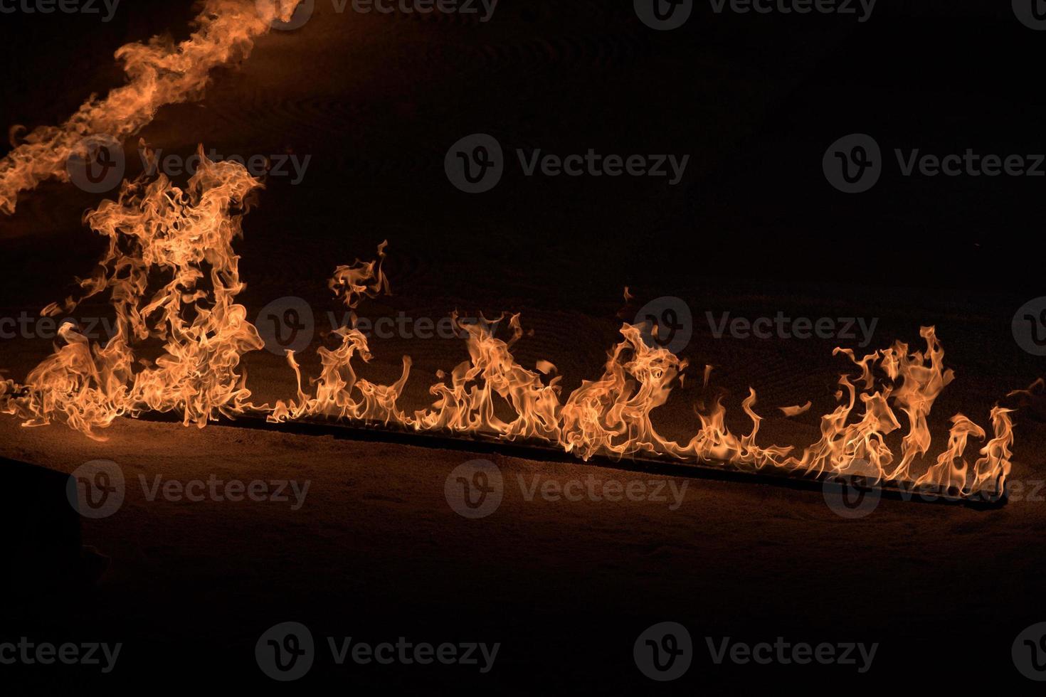 Orange Flames on black background photo