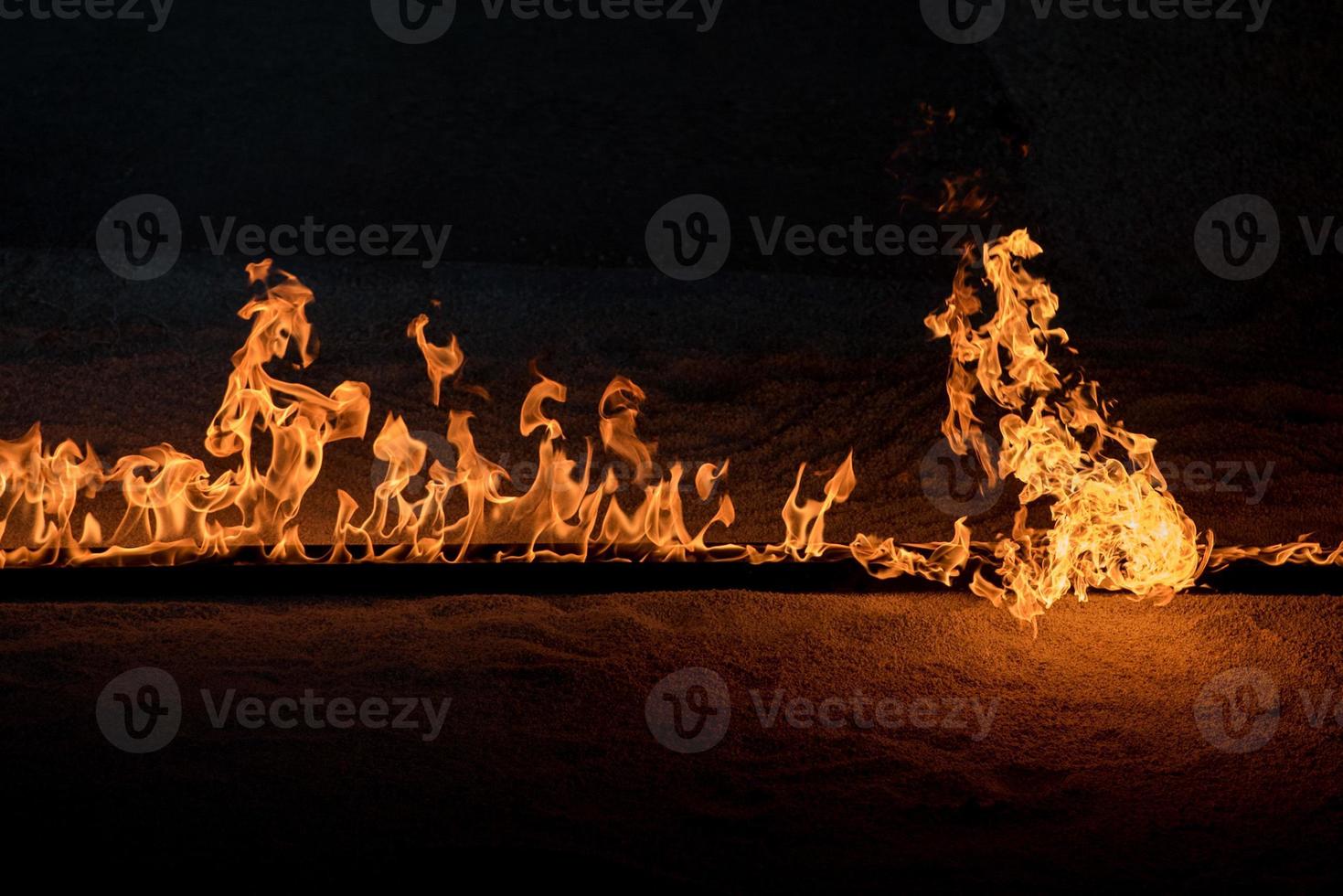 Orange Flames on black background photo