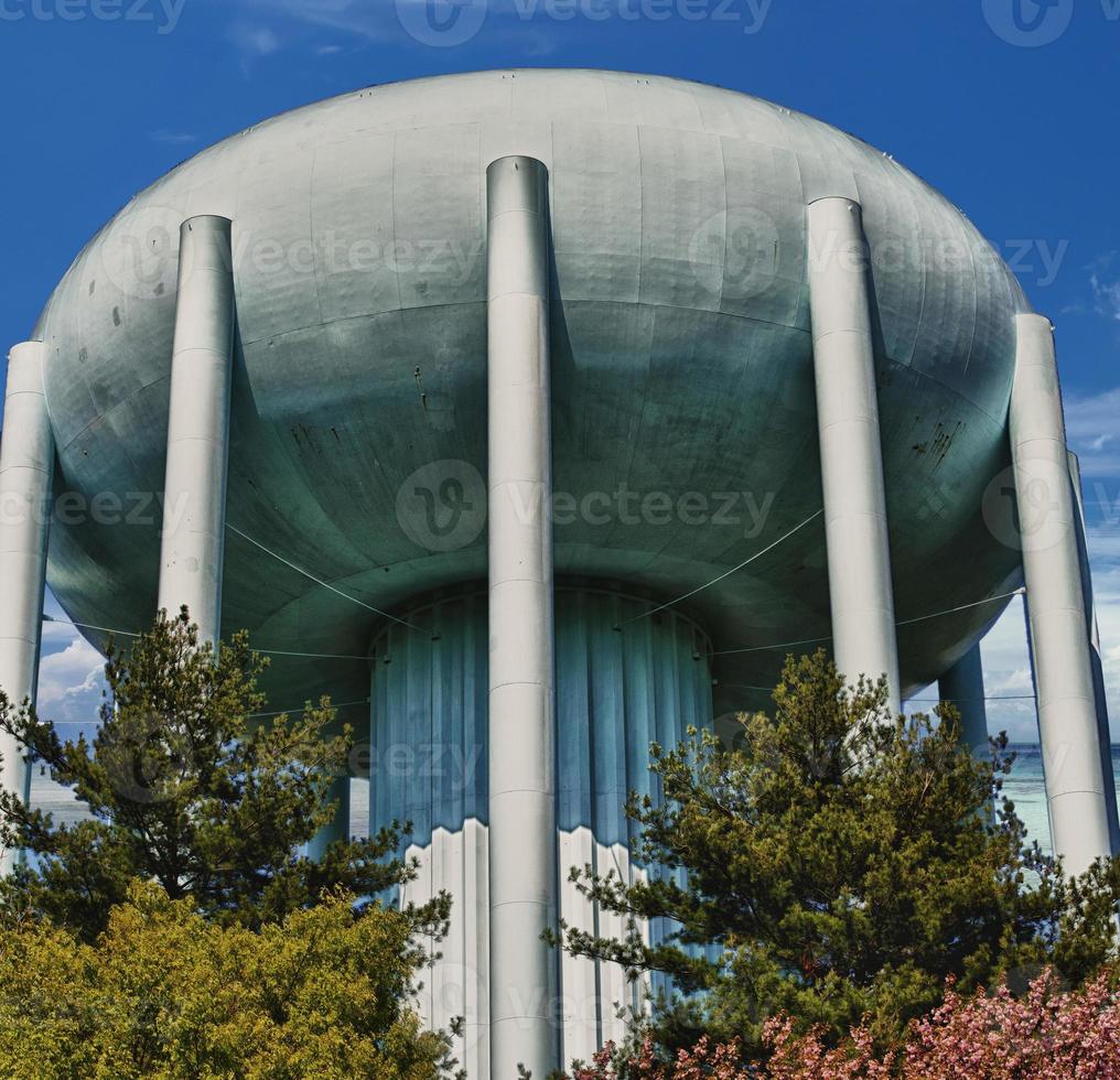 A water tower in the deep blue sky photo
