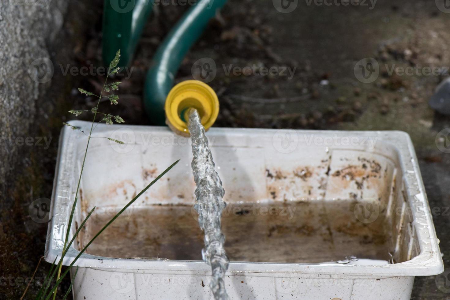 water falling from open tap photo