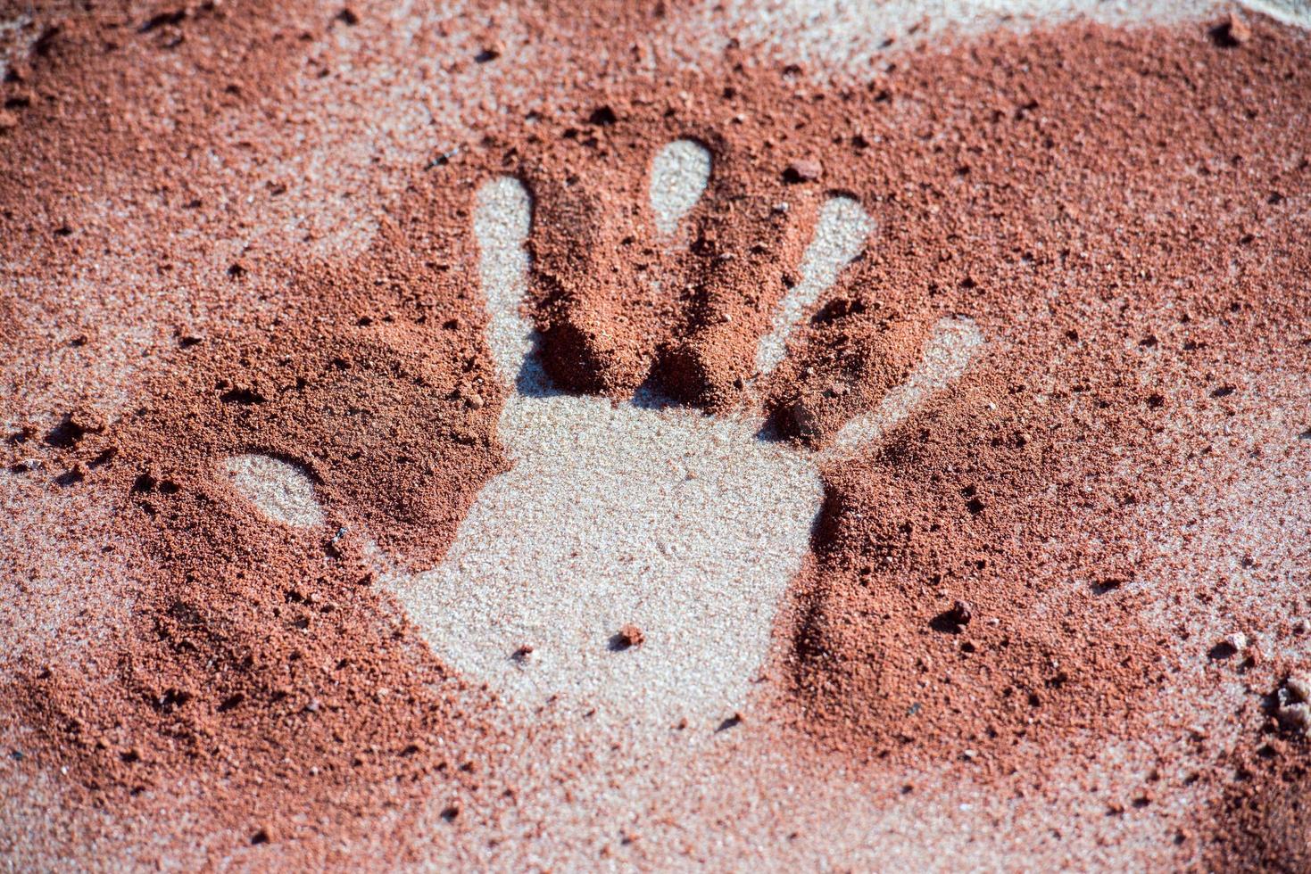 hand shape on sand like aboriginal art style photo
