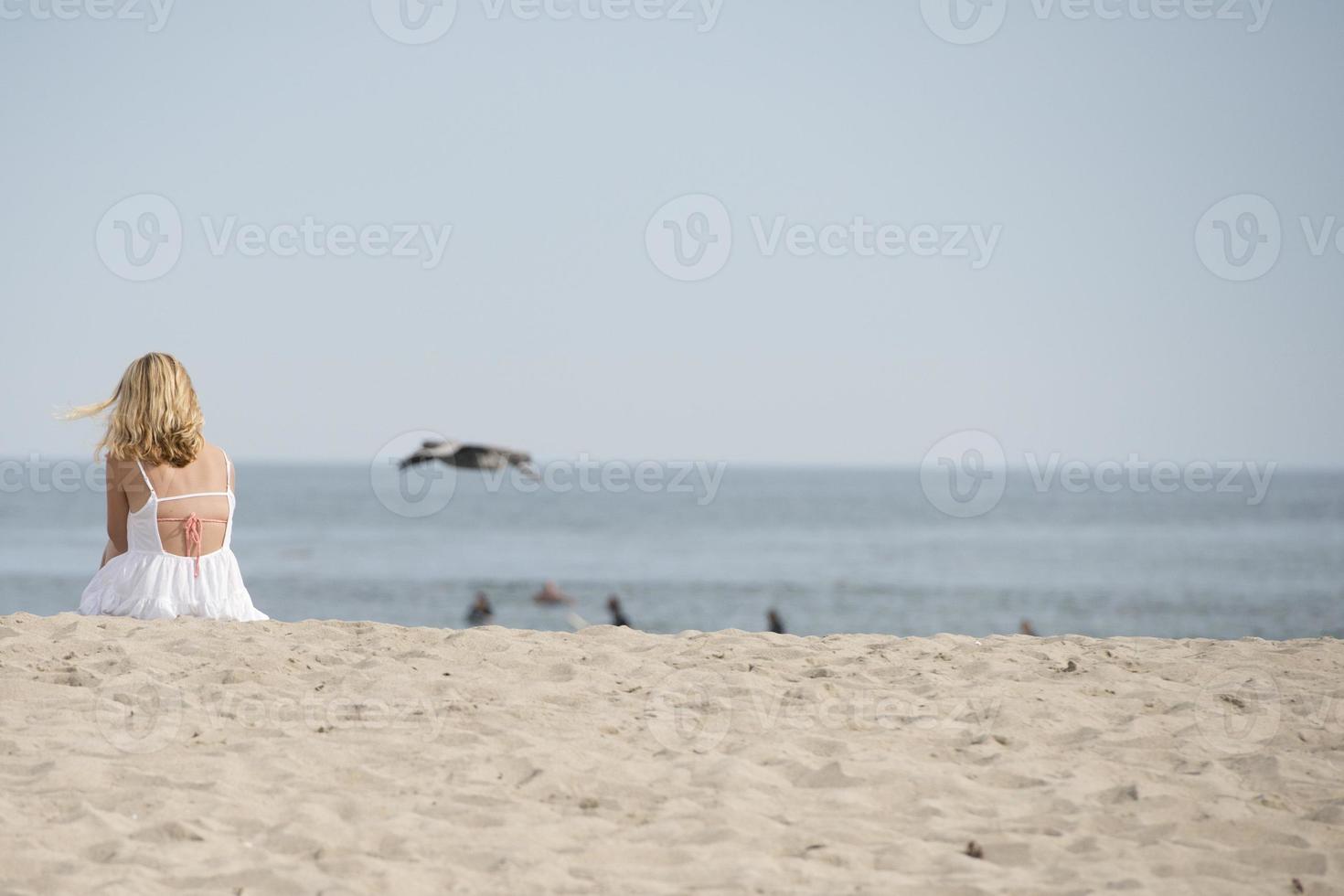 woman relaxing in malibu beach photo