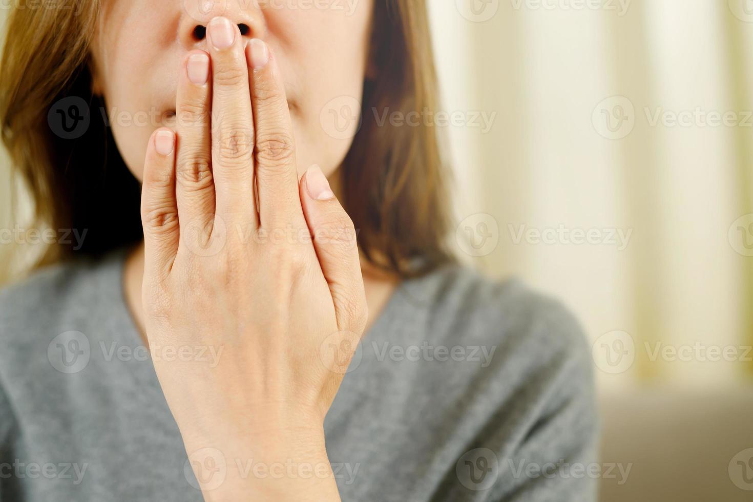 Women have bad breath caused by swollen gums. photo