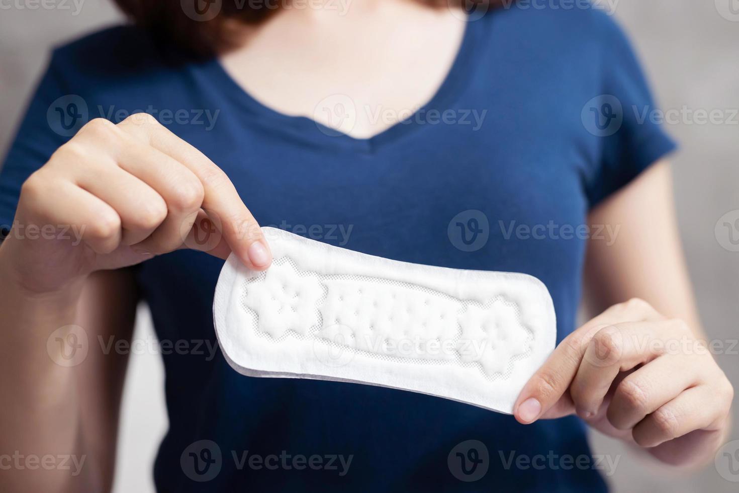 A woman with a sanitary napkin photo
