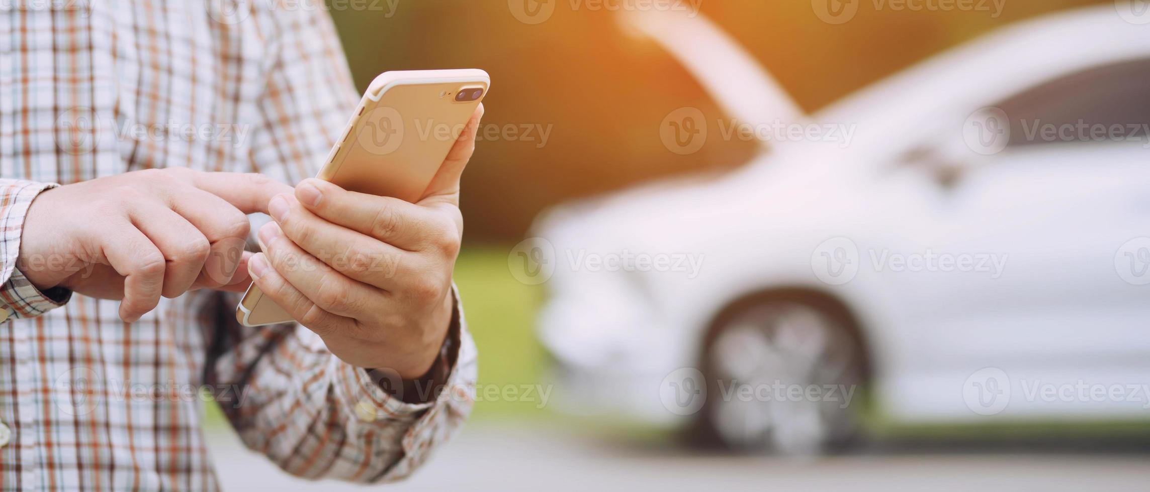 close up businessman hand using a mobile smart phone call a car 