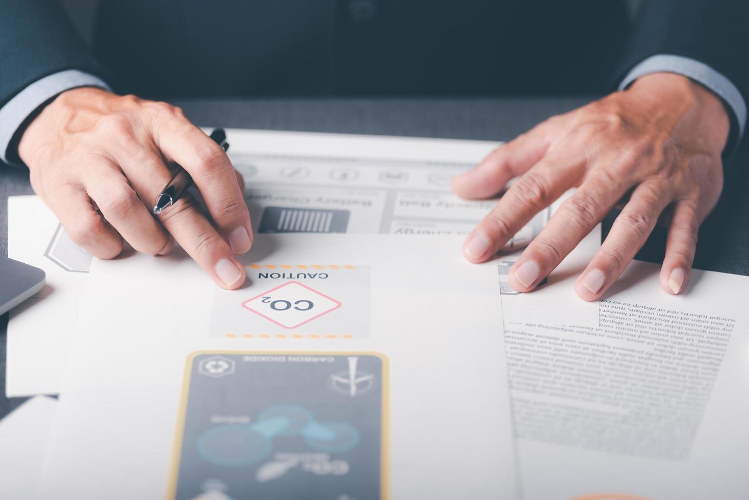 Industrial emissions pollute the environment and ecosystems. Including climate change, renewable energy agreements, carbon emissions reductions, business people check documents on tables. photo
