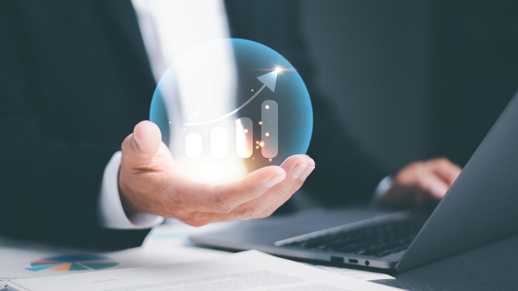 businessman holding an icon show growth and success in business,development concept,industry revenue target,management Invest and Profit with Growth Data Analysis, Market Leadership Strategies photo