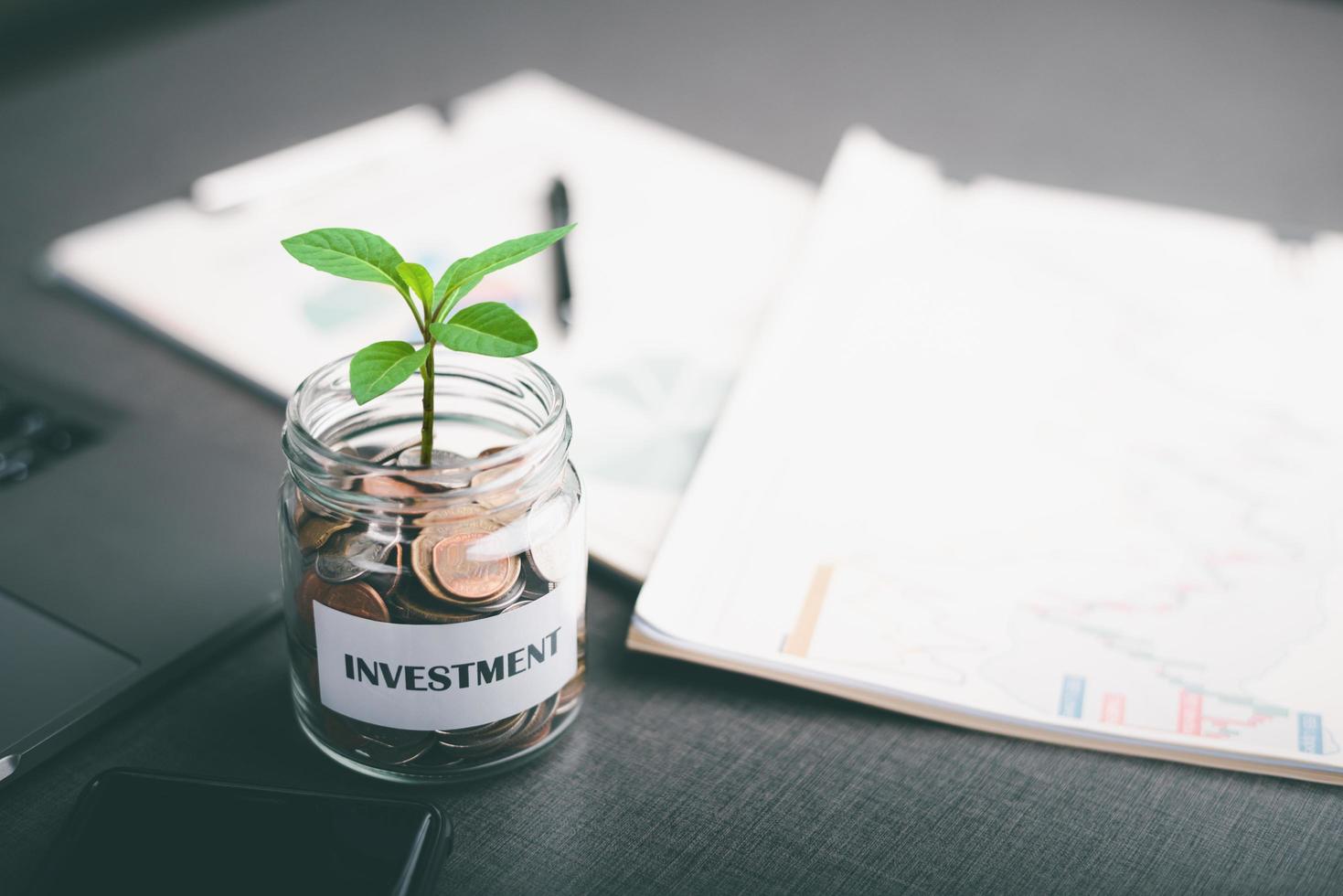 Message on paper and coins in glass jar,savings concept. financial growth, business investment and currency exchange, financial asset investment management,Sustainable Profit Increase photo