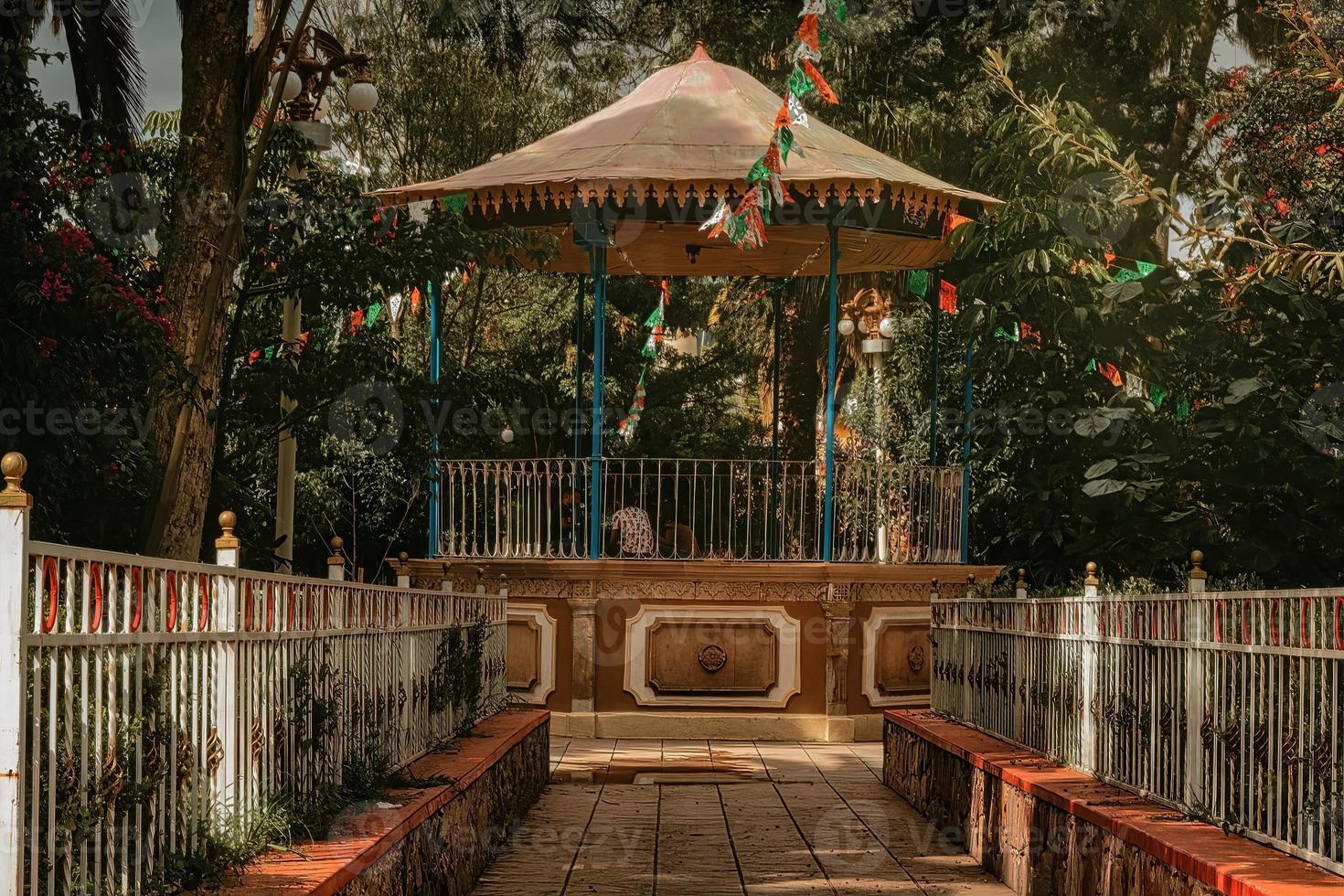 Rustic and traditional kiosk in Mexican garden photo