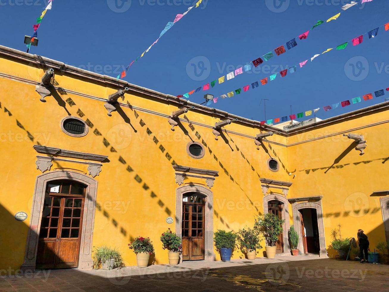 Mexican yellow house with colloquial architecture photo