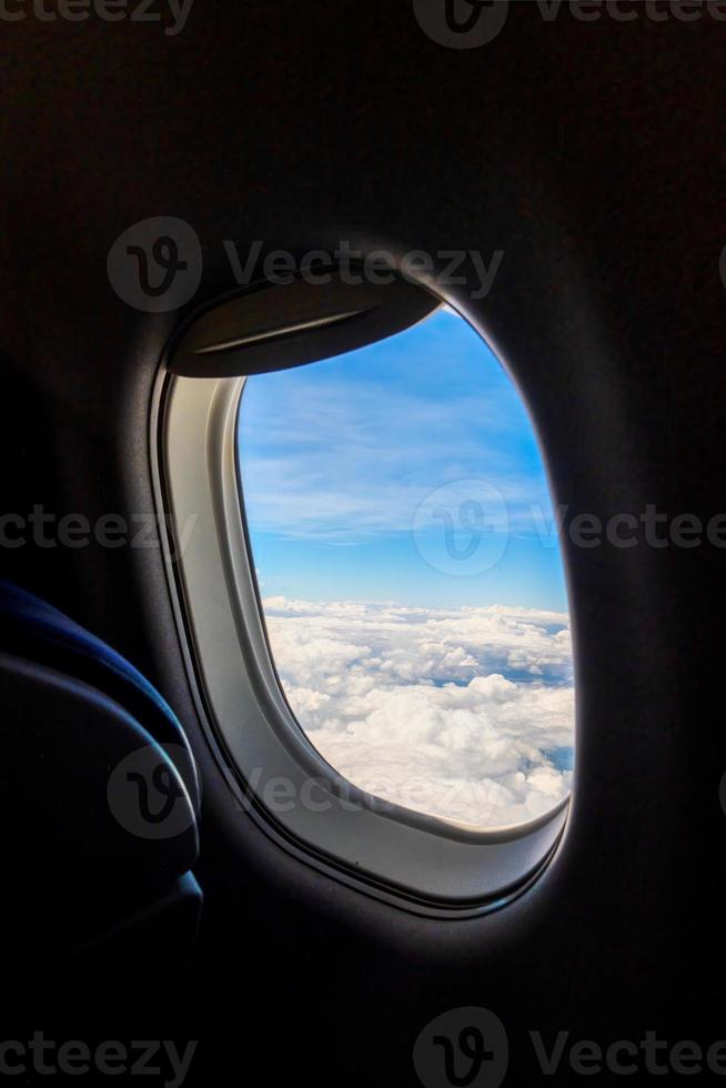 Airplane window view with landscape outside and copyspace photo