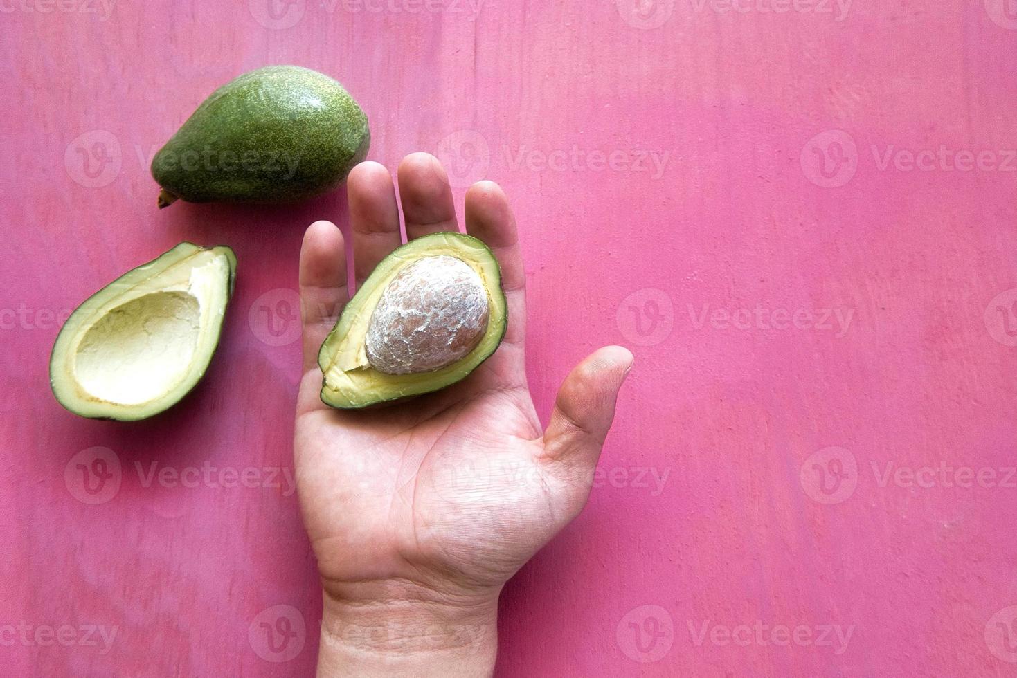 Avocados texture with pink vintage background photo