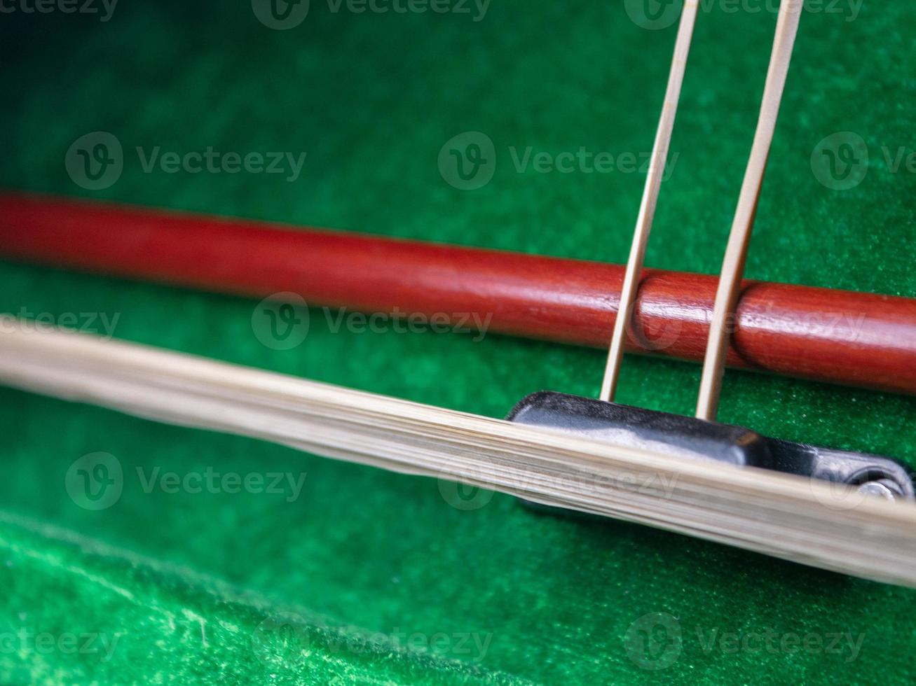 Red wooden violin in box photo