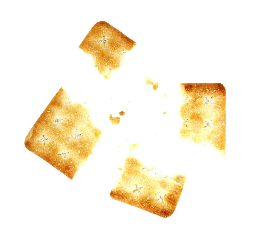 whole wheat cracker and broken crushed on white background photo