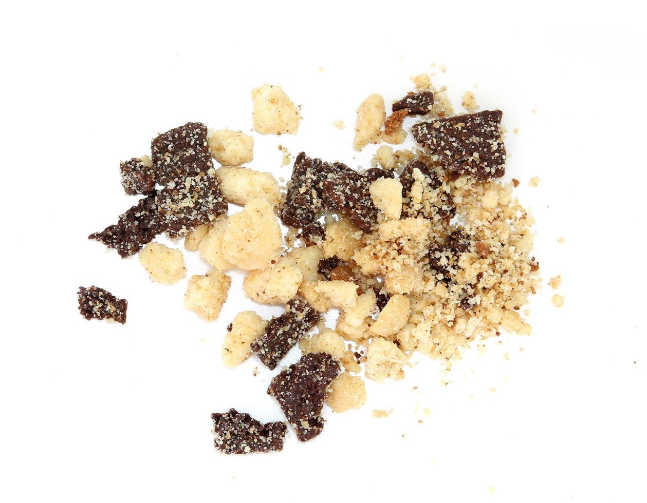 chocolate and cookie crumbs on white background photo