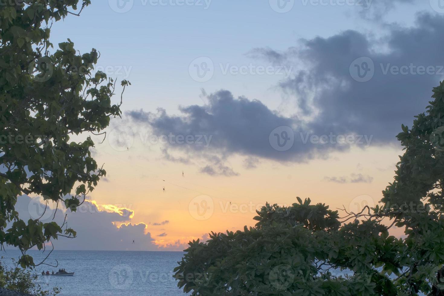 A wonderful sunset in tropical paradise sand beach photo