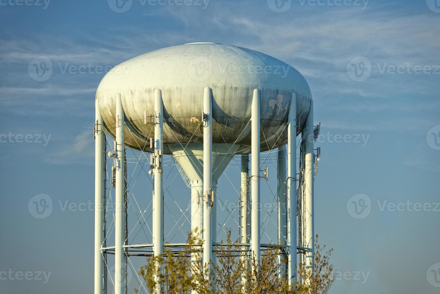 A water tower in the deep blue sky photo