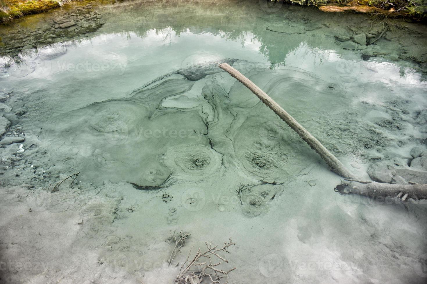 Natural hot pools in rocky mountains photo