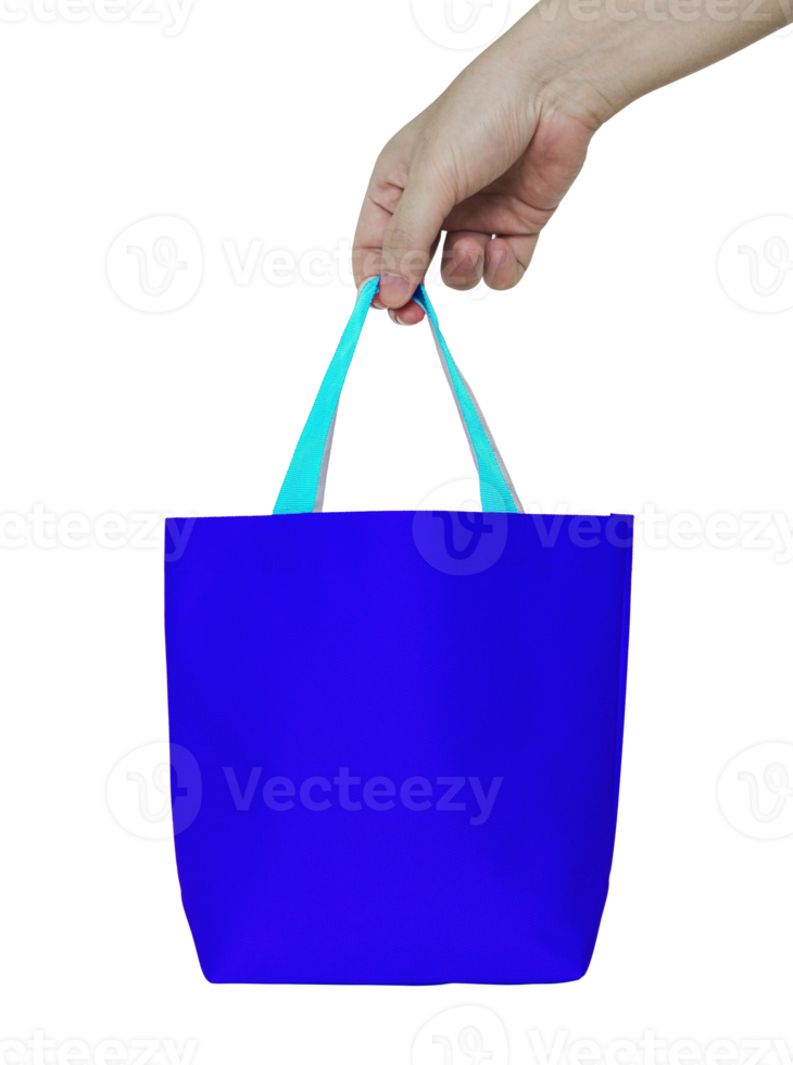hand holding blue fabric bag isolated with clipping path for mockup png