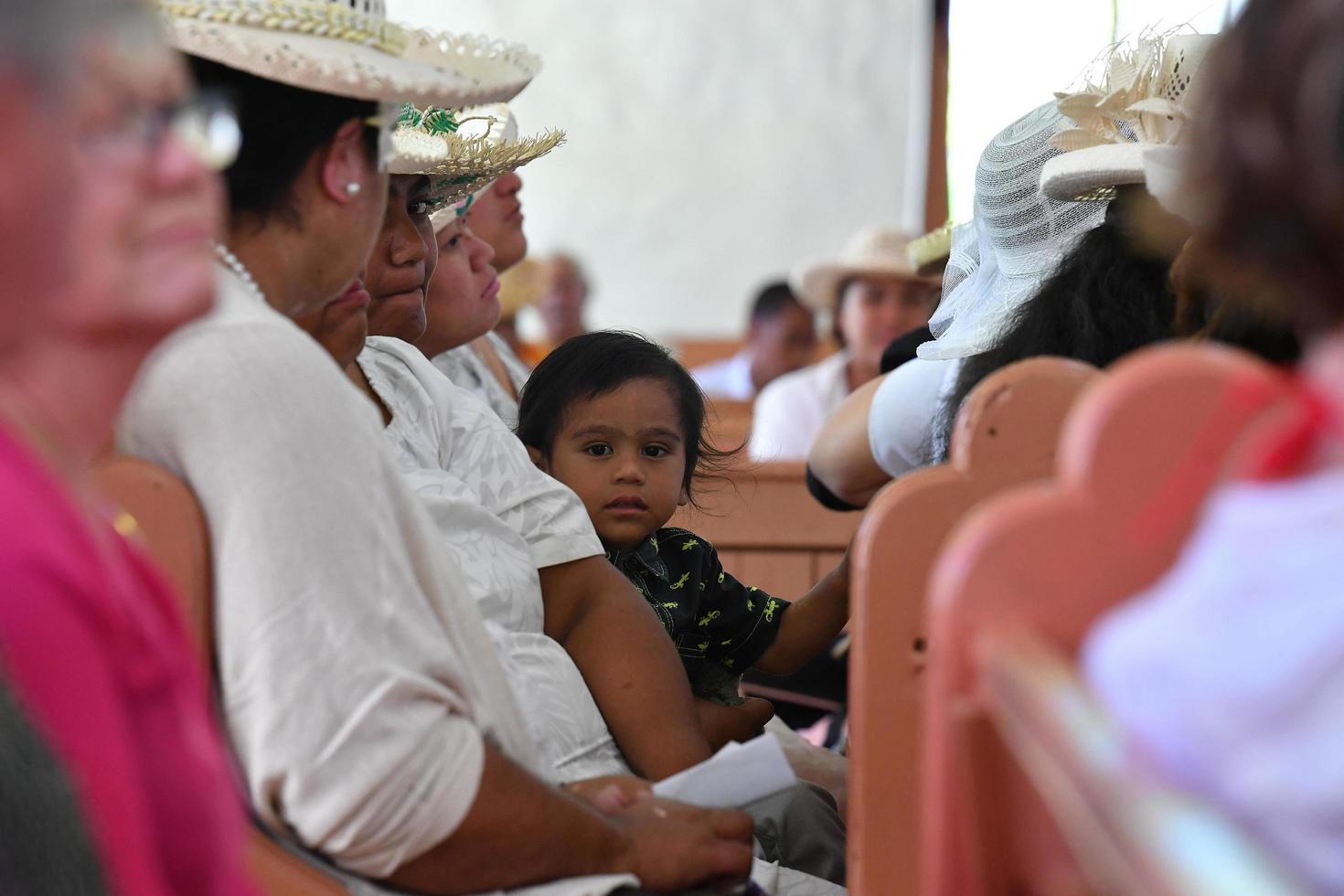 AITUTAKI, COOK ISLAND - AUGUST, 27 2017 - Local people at the mass photo