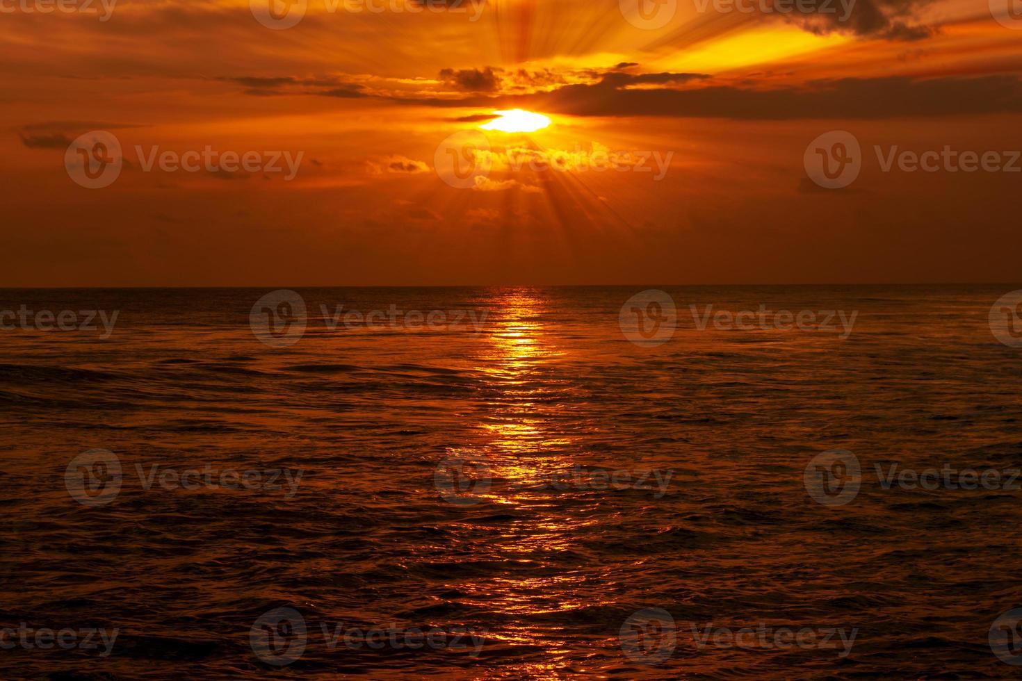 Beautiful sea landscape at sunset with orange sky photo