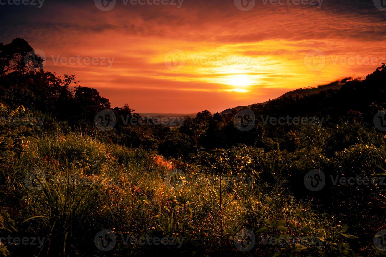 Beautiful glowing sunset landscape over the valley photo