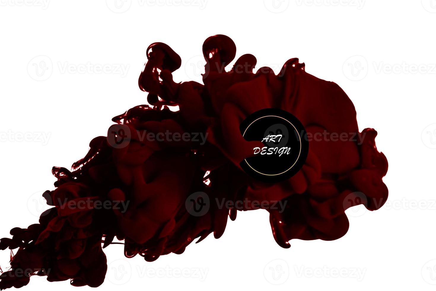 a drop of red ink falls on the water. color drops in water , Abstract artistic element for design photo