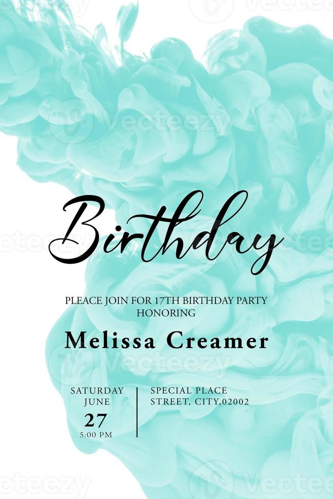 Birthday card template design with blue acrylic ink in water form an abstract smoke pattern isolated on white background photo