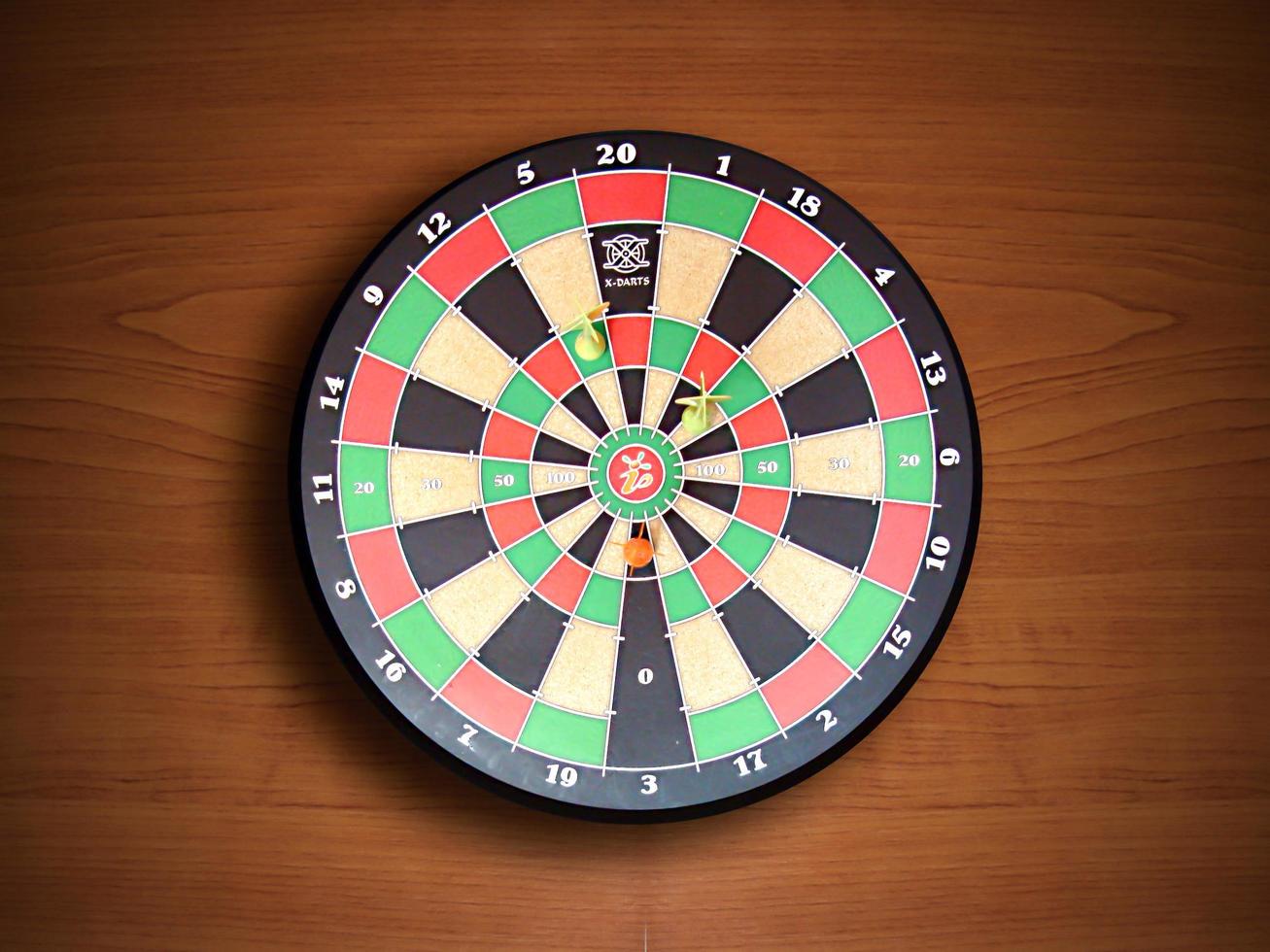 Dartboard on wood wall photo