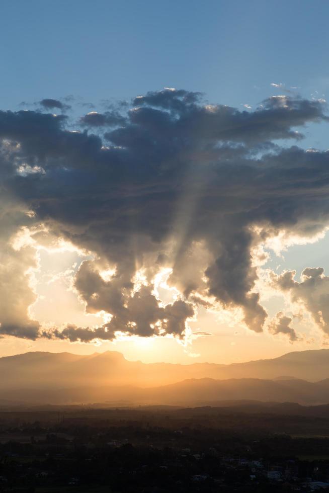 sunrise with clouds, light and rays photo