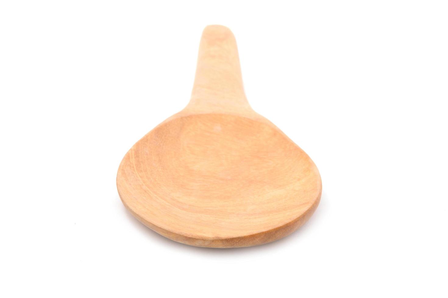 Rice wood spoon isolated on white background photo