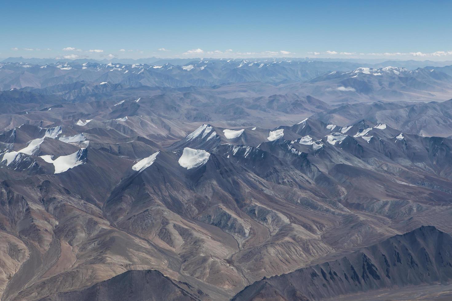 Himalaya mountains under clouds photo