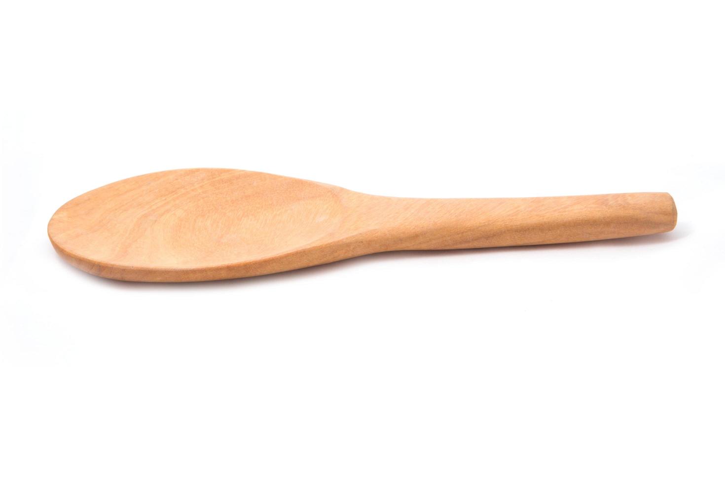 Rice wood spoon isolated on white background photo