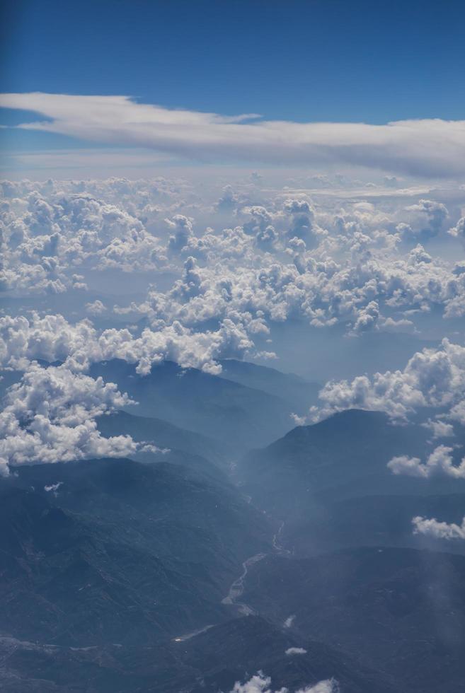 Himalaya mountains under clouds photo