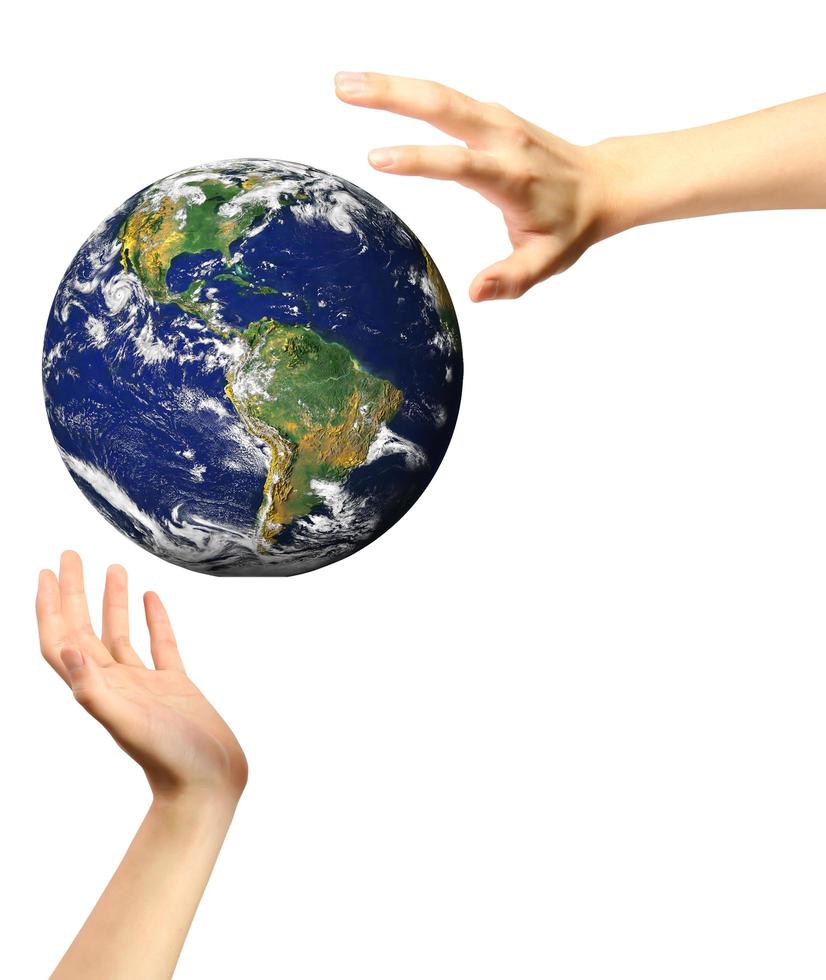 conceptual image of a big globe on hands photo