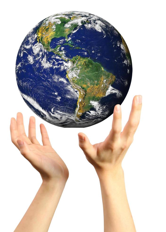 conceptual image of a big globe on hands photo