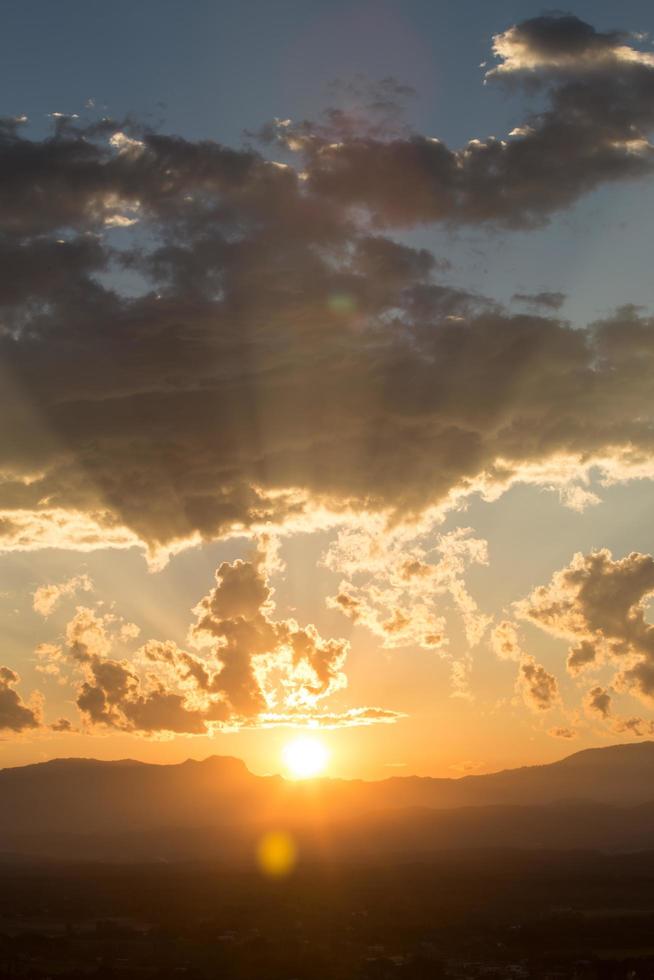 sunrise with clouds, light and rays photo