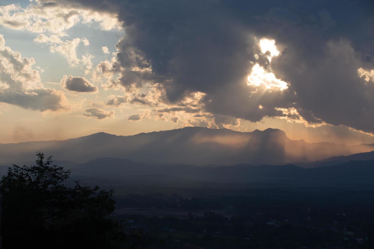 sunrise with clouds, light and rays photo