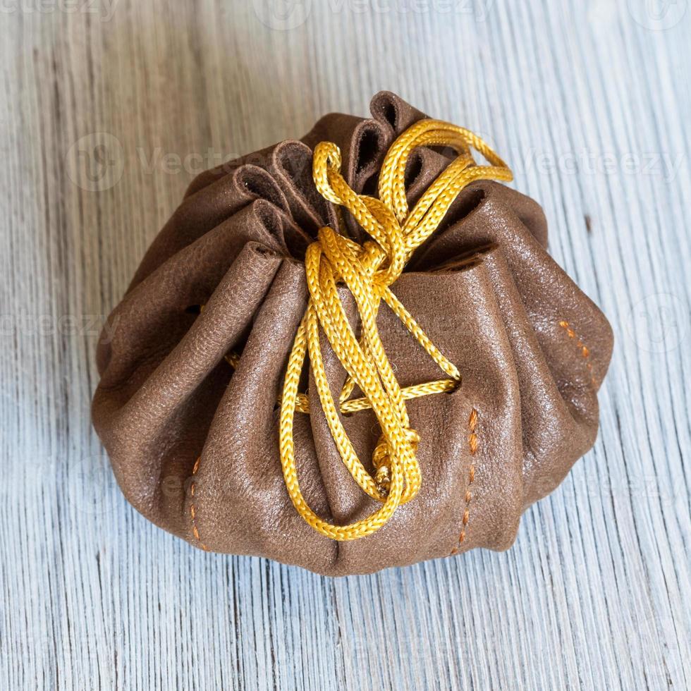above view of small tied leather purse photo